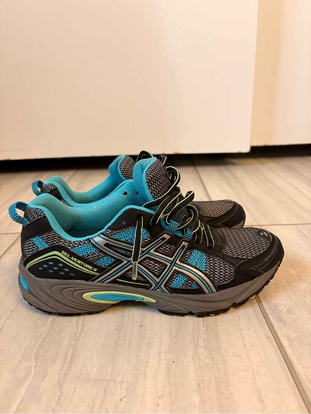 Women’s Asics Gel- Venture 4. Black, gray, blue and green
